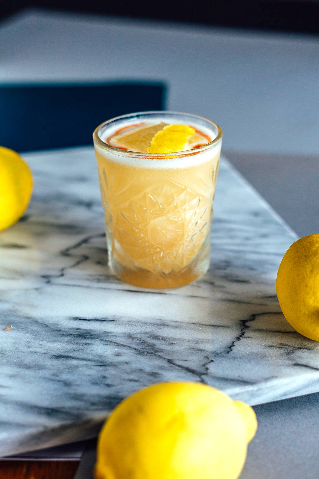 Lemon cocktail on a marble serving tray